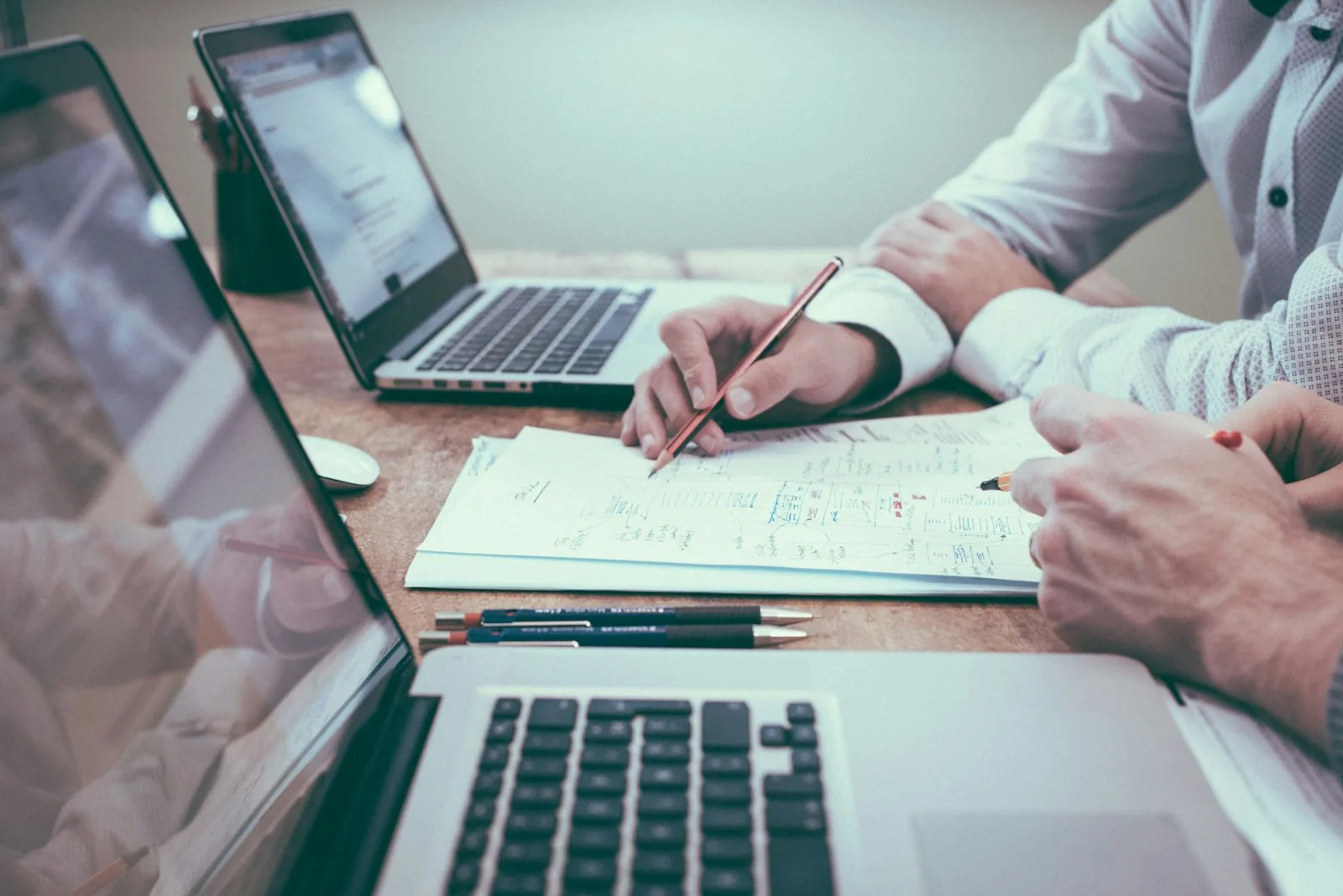 Business plans, laptop and notes on a desk